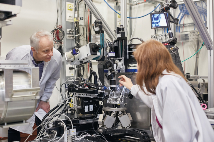 "We study the mechanical properties of zhe lyers using a nanoindenter." - Keckes. Photo: Hereon/ R. Otzipka Physicist Dr. Christina Krywka and physicist Prof. Jozef Keckes at the beamline